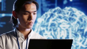 Portrait of joyful professional maintenancing artificial intelligence neural networks made up of interconnected nodes. Cheerful computer operator updates AI system processing information, close up - Powered by Shutterstock - Get 15% off with code: PIKWIZARD15