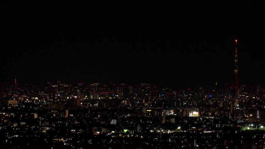 TOKYO, JAPAN : Aerial high angle sunrise view of CITYSCAPE of TOKYO and MOUNT FUJI. Rising sun and buildings at downtown area. Japanese city life and nature concept. Time lapse shot, night to morning.