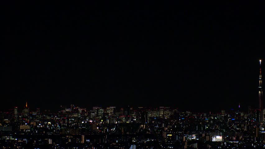 TOKYO, JAPAN : Aerial high angle sunrise view of CITYSCAPE of TOKYO and MOUNT FUJI. Rising sun and buildings at downtown area. Japanese city life and nature concept. Time lapse shot, night to morning.
