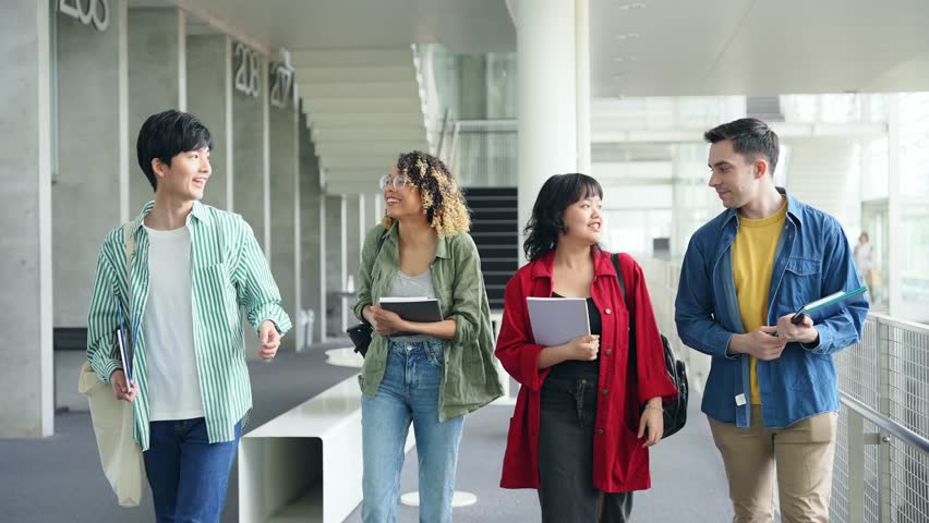 Multinational youth group walking in building. College students. Royalty-Free Stock Footage #1107982081
