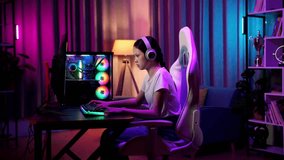Asian Teen Girl Gamer Lose While Playing Video Game On Computer
