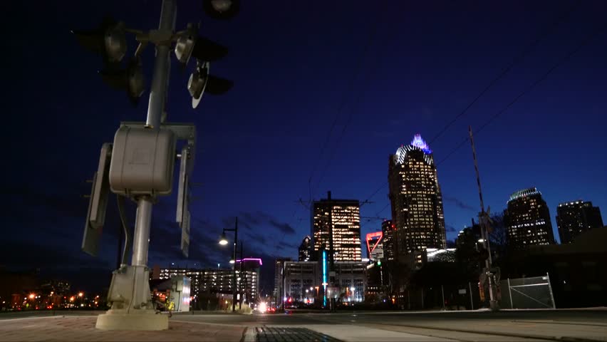 
Commuter rail crossing in downtown Charlotte North Carolina at evening twilight