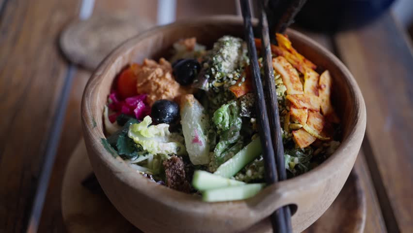 Healthy vegan food. Organic and clean eating. Olives, Sesame, tomatoes, herbs