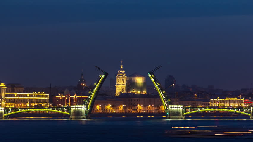 Timelapse from Trinity Bridge captures the night view of opened Birzhevoy Bridge and Tserkov