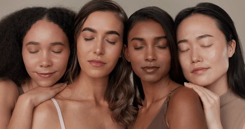 Women, natural beauty and face with diversity, skincare and wellness for inclusion in studio. Cosmetics, brown background and female group with dermatology, community and friends together for glow स्टॉक व्हिडिओ
