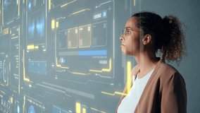 Young Black woman touching futuristic holographic graphical user interface. Digital technology. - Powered by Shutterstock - Get 15% off with code: PIKWIZARD15