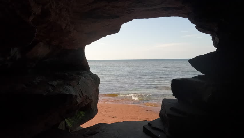 Looking at the ocean through a rock cave - close up