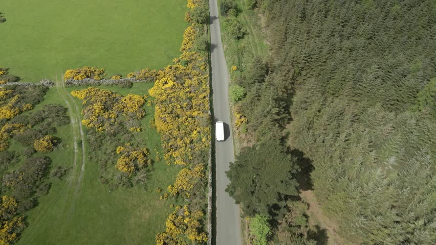 Courier delivery van commuting at Wicklow mountains Ireland aerial  Royalty-Free Stock Footage #1108007399