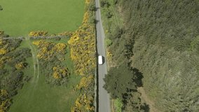 Courier delivery van commuting at Wicklow mountains Ireland aerial  - Powered by Shutterstock - Get 15% off with code: PIKWIZARD15