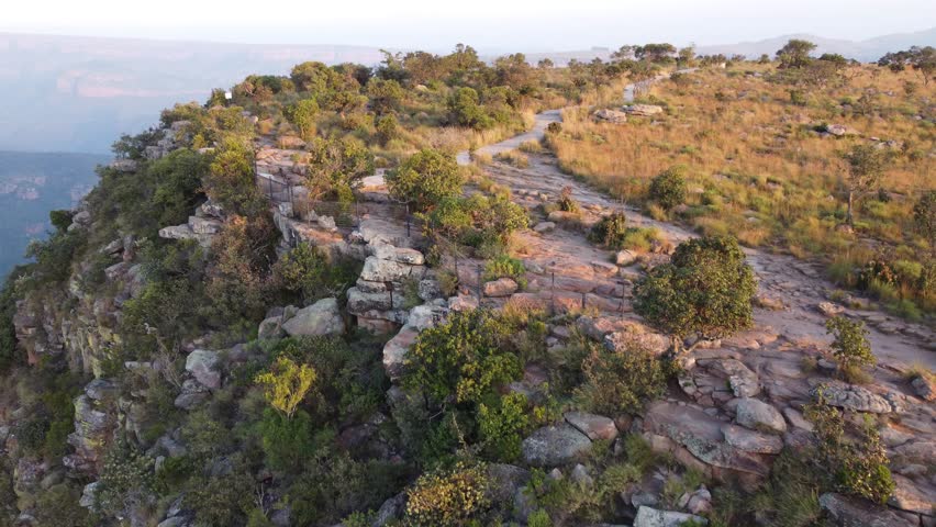 Hiking Trail Atop Rocky Cliff In Drakensberg Mountains, South Africa. aerial