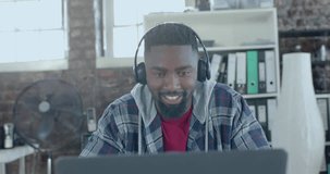 Animation of data processing over happy african american businessman with headphones in office. Global business, technology and digital interface concept digitally generated video.