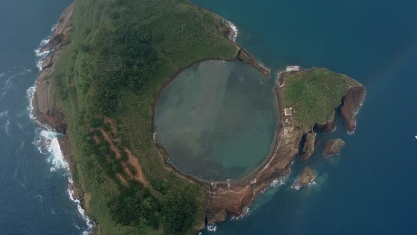 Volcanic caldera aerial, now flooded on offshore islet, Azores POR Royalty-Free Stock Footage #1108020917