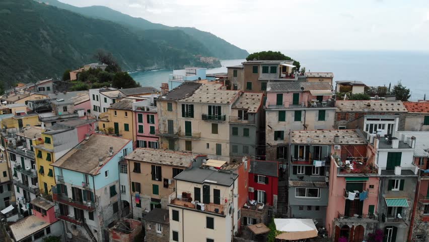 Fly away from Village of Corniglia in aerial view, Cinque Terre coast of Italy. small town in the province of La Spezia, in Liguria, in northern Italy and one of the Cinque Terre attractions. 