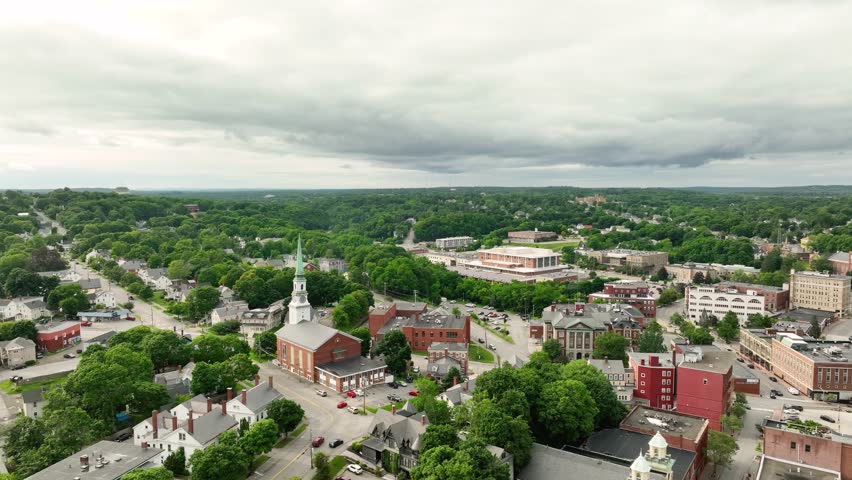 Wide aerial view of Bangor, Maine with the Hammond Street Congregational Church prominently featured.