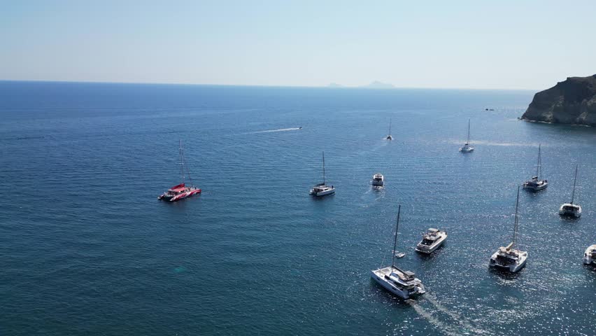 Red Beach. Santorini Island. Thira. Greece. Drone. 4K. Yachts.