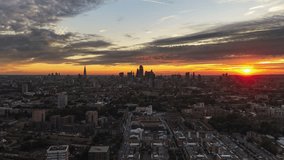 Aerial View Shot of London UK, United Kingdom, green summer, icredible sunset, orange and red, London Skyline, Shard, City od London, Square Mile, Total, push in