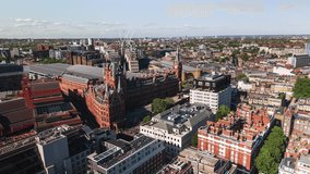 Aerial View Shot of London UK, United Kingdom, green summer, Kings Cross, St Pancras International, Angel, Islington, track back reveal
