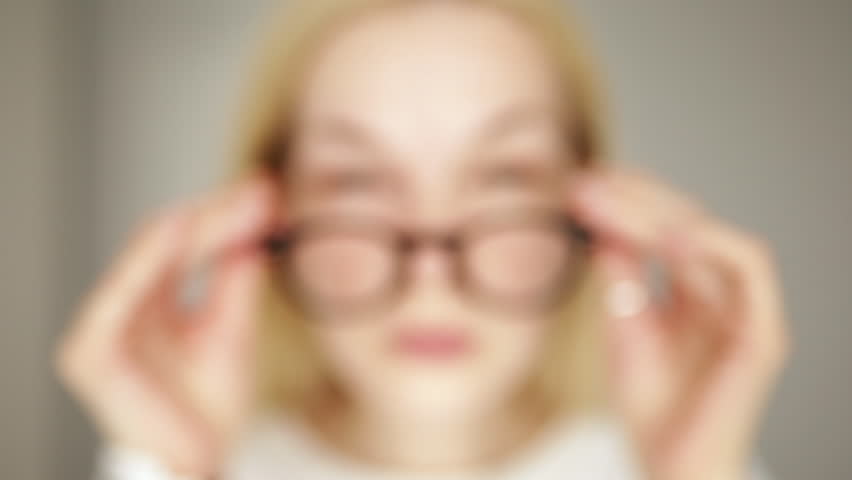 A tired woman takes off her eyeglasses and rubs her eyes with her hands, she sees badly and everything is blurred. Poor vision concept. Royalty-Free Stock Footage #1108039527