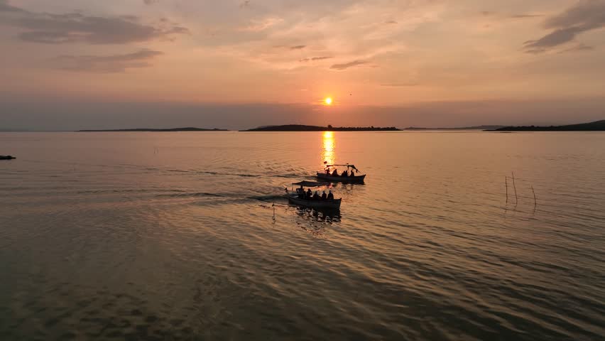 Fisherman Boat Sunset Time in the Golyazi Peninsula Drone Video, Golyazi Bursa, Turkey (Turkiye) Royalty-Free Stock Footage #1108043327