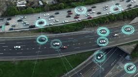 Aerial View of Highway Full of Traffic, Autonomous Vehicles Connected to Futuristic Network. Driverless Cars with Holographic HUD Elements. Intelligent Traffic Detection System. Smart Transportation. - Powered by Shutterstock - Get 15% off with code: PIKWIZARD15
