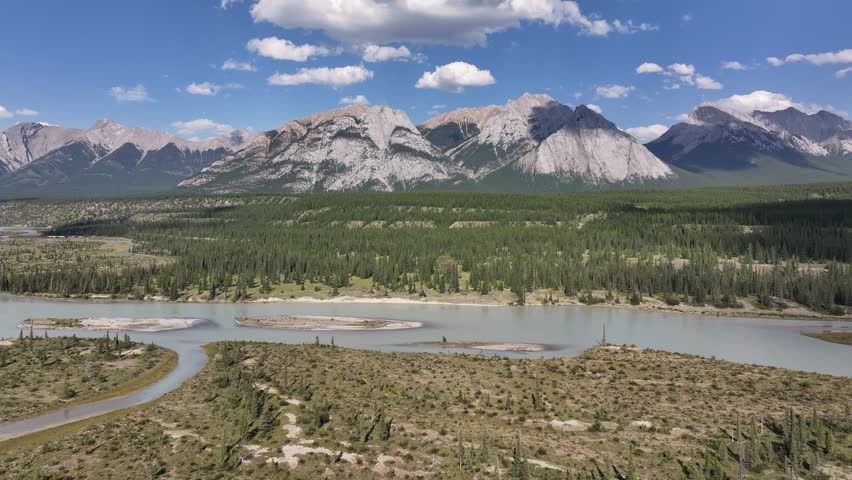 Drone view of the turquoise waters of the North Saskatchewan River as it cuts through the Kootenay Plains Ecological Reserve and Mt. William Booth in the background