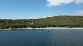 Unveil the beauty of Étang de Berre, just 30min from Marseille, through 4K drone footage. Soar over boats navigating the inland sea, surrounded by national parks. Ideal for projects on travel, nature.