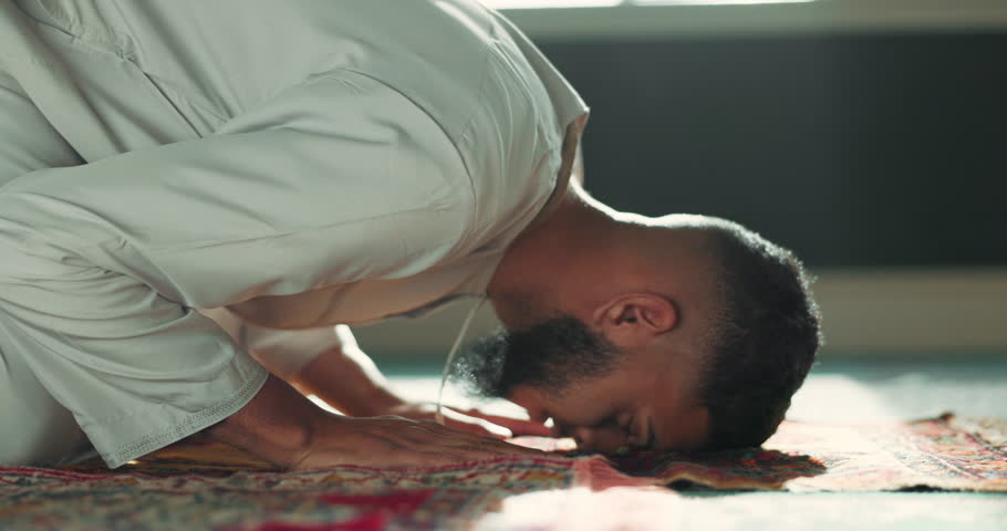 Islamic prayer man on mat in mosque with mindfulness, love and gratitude in faith commitment. Worship, religion and Muslim person in holy temple for praise, spiritual teaching and meditation peace. Royalty-Free Stock Footage #1108061651