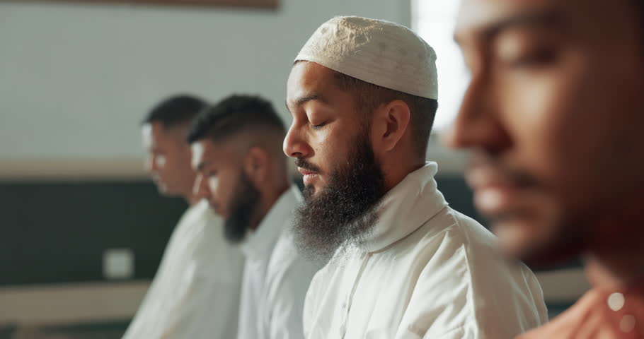 Muslim, praying and group in a Mosque for spiritual religion together as men to worship Allah in Ramadan. Islamic, Arabic and holy people with peace or respect for gratitude, trust and hope for eid Royalty-Free Stock Footage #1108061687