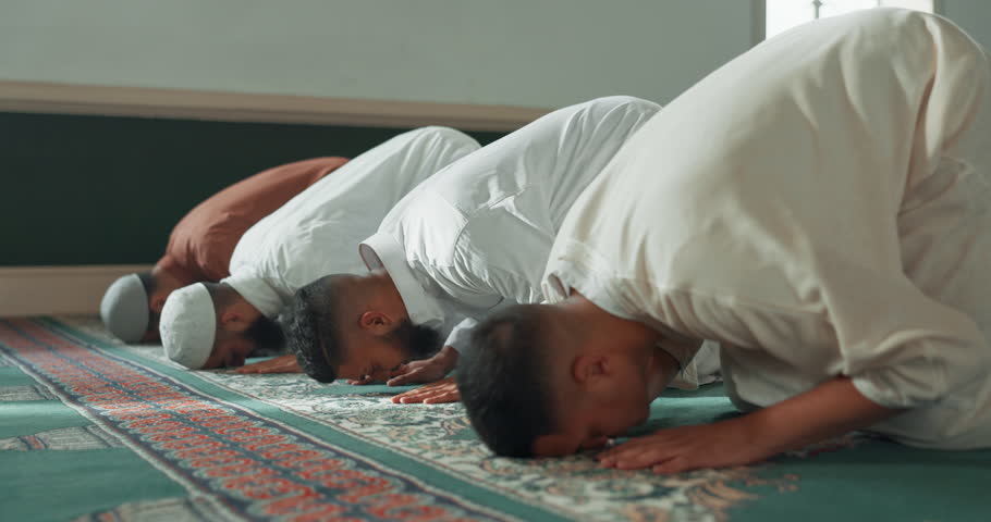 Muslim, praying and men in a Mosque for spiritual religion together as a group to worship Allah in Ramadan. Islamic, Arabic and holy people with peace or respect for gratitude, trust and hope Royalty-Free Stock Footage #1108062149