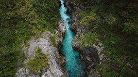 4K UHD Cinemagraph seamless video loop of mountain river Soča in Triglav National park in Slovenia in the Slovenian alps. The clear blue water is rushing through a naturally formed canyon and rocks.