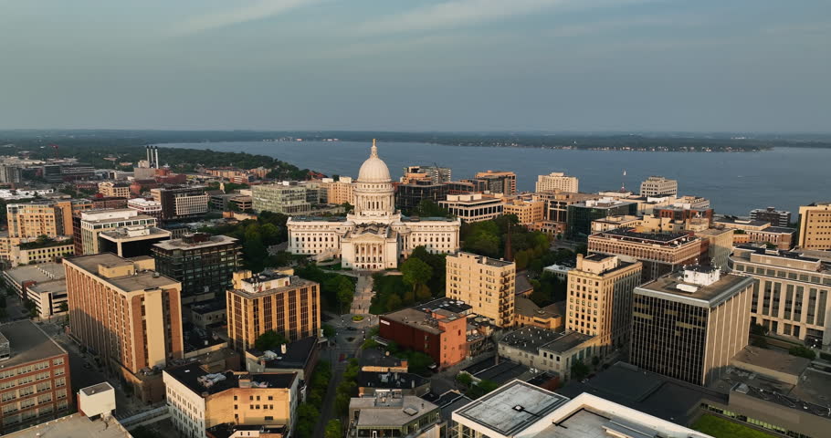 Aerial pan shot of Madison downtown and Wisconsin State Capitol building. Late afternoon light