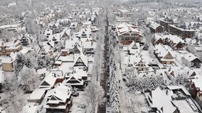 Piłsudskiego Street covered in Winter snow from above - Drone Aerial Zakopane - Powered by Shutterstock - Get 15% off with code: PIKWIZARD15