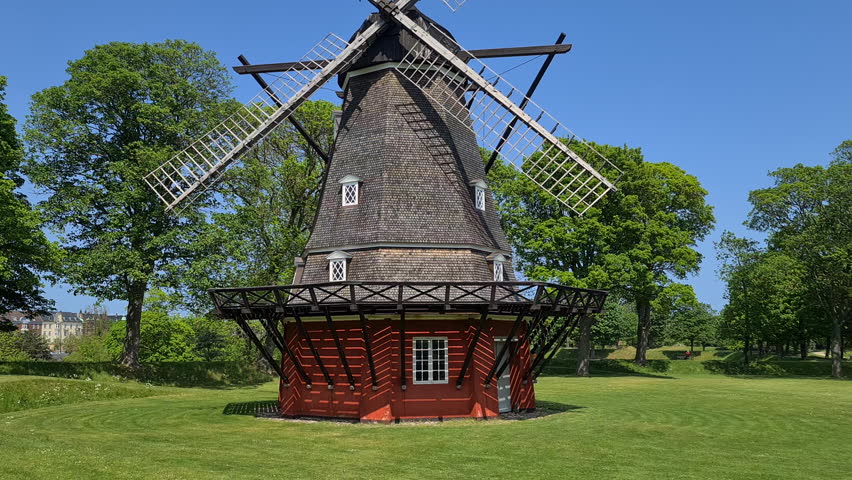 Old Traditional Windmill in Green Landscape on Sunny Summer Day, Tilt Up Royalty-Free Stock Footage #1108069259