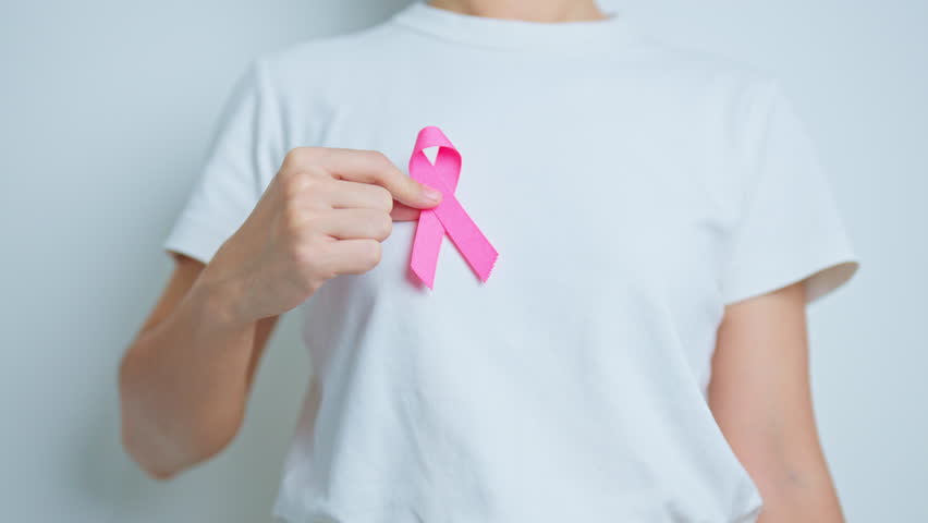 Pink October Breast Cancer Awareness month, woman doctor with pink Ribbon in hospital for support people life and illness. National cancer survivors month, Mother and World cancer day concept | Shutterstock HD Video #1108074929