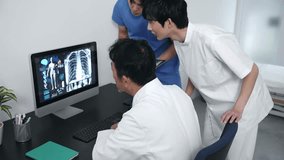 A group of medical staff having a meeting while looking at a PC screen.　Teamwork of medical occupation. - Powered by Shutterstock - Get 15% off with code: PIKWIZARD15