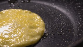 Close up panarama Egg yolk is fried in a pan. High quality FullHD footage
