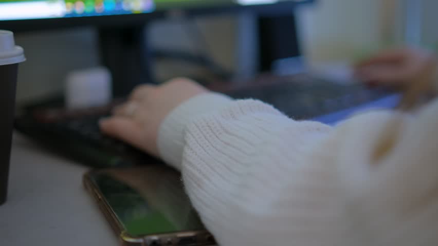 A young woman video editor works with a video sequence on a computer. 4K Royalty-Free Stock Footage #1108082957