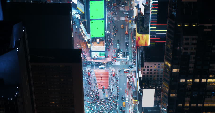 New York City Night Aerial Landscape with Manhattan Skyscrapers and Crowded Times Square Tourist Landmark. Cinematic Drone View with Green Screen Mock Up Billboards and Commercials with Neon Lights