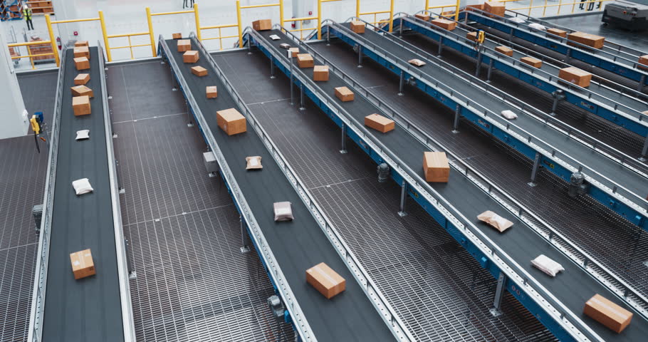 High Angle Footage with Modern Industrial Logistics Center with Multiple Automated Sorting Conveyor Belt Systems. Retail Online Orders are Transported for Express Delivery to Customers Worldwide Royalty-Free Stock Footage #1108084693