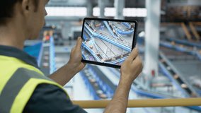 Logistics Center Worker Using Tablet Computer with Augmented Reality Software Controlling Parcel Delivery on a Conveyor Belt. International Online Shopping Business Facility with Modern Technology - Powered by Shutterstock - Get 15% off with code: PIKWIZARD15