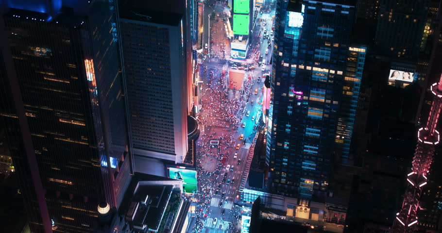 Helicopter Night Tour of New York City. Fly-By Over Glowing Times Square with Green Screen Mock Up Advertising Templates and Tourists Enjoying Manhattan Nightlife and Admiring the Landmark