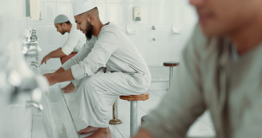 Muslim, religion and men washing before prayer in bathroom for purity, and cleaning ritual. Islamic, worship and faith of group of people with wudu together at a mosque or temple for holy practice