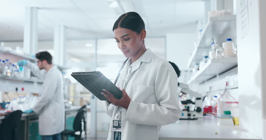 Woman, scientist and tablet in research, study or new discovery together at science laboratory. Happy female person, medical or healthcare worker smile with technology in data or scientific tests Royalty-Free Stock Footage #1108090035