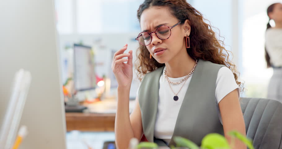 Headache, burnout and young woman in the office with project mistake, crisis or problem. Migraine, stress and tired professional female designer with frustration working on research in the workplace. | Shutterstock HD Video #1108090139