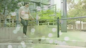 Animation of data processing over plus size caucasian woman exercising in city street. Sports, active lifestyle, urban living and happiness concept digitally generated video.