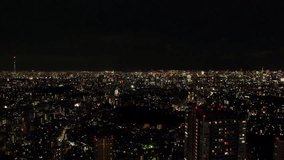 TOKYO, JAPAN : Aerial sunrise view of CITYSCAPE of TOKYO. Dawn sky and buildings at downtown area. Japanese city life and urban metropolis concept 4K video. Long time lapse shot, night to morning.