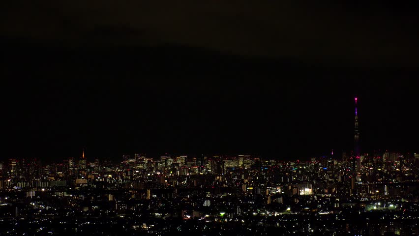 TOKYO, JAPAN : Aerial high angle sunrise view of CITYSCAPE of TOKYO and MOUNT FUJI. Rising sun and buildings at downtown area. Japanese city life and nature concept. Time lapse shot, night to morning.