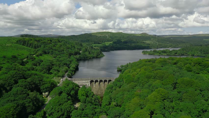 An aerial drone shot of Burrator Reservoir Dam at Dartmoor National Park, Devon.