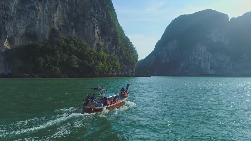 small tourist boat Sailing in the southern seas of Asia (Thailand). through the valley in the middle of the sea with many islands Royalty-Free Stock Footage #1108102001