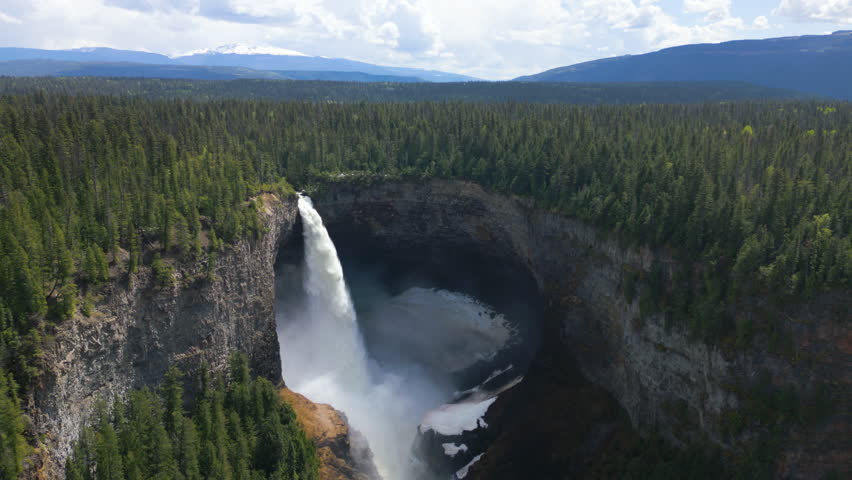 Stunning view of Helmcken Falls in spring, Canada. Slow aerial backwards